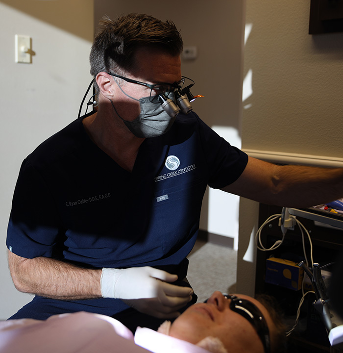 Dental patient receiving a scan of his mouth and jaws
